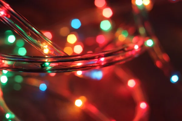 Christmas garland Christmas lights on wooden background. Selective focus — Stock Photo, Image