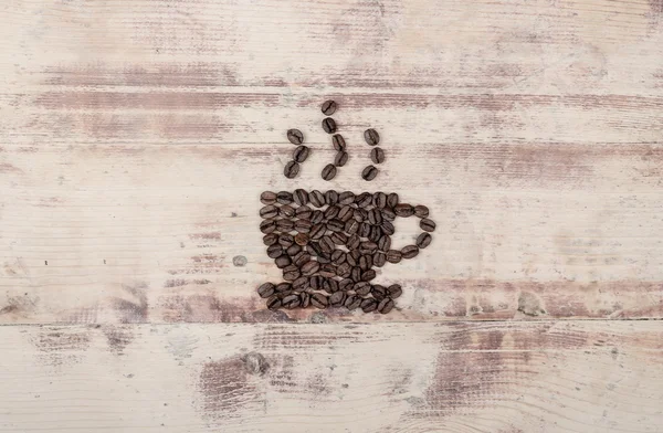 Kleine Tasse Kaffee mit Bohnen — Stockfoto