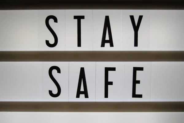 Lightbox Sign Saying Stay Safe Written Black Letters White Background — Stock Photo, Image