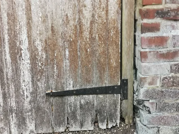 Black Metal Hinge Old Rotting Gate Brick Wall Side High — Stock Photo, Image