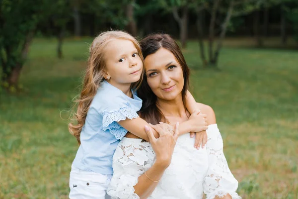 Five Year Old Daughter Hugs Her Mother Neck — Stock Photo, Image