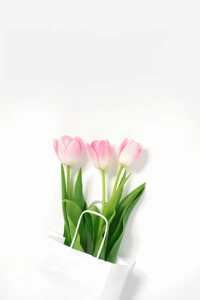 Flat Lay Composition Pink Tulips Paper Bag White Background — Stock Photo, Image