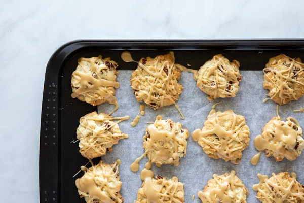 Top down view of a cookie sheet filled with homemade maple pecan cookies, fresh out of the oven. — Stock Photo, Image