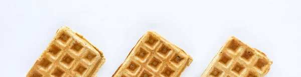 Narrow view of plain homemade whole grain waffles against a white background. — Stockfoto