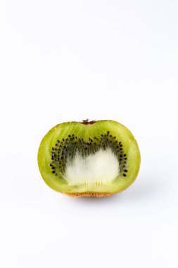 Close up of a cross section of a kiwi isolated against a white background. clipart
