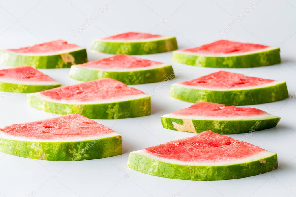 Fresh juicy watermelon slices receding into the background. 