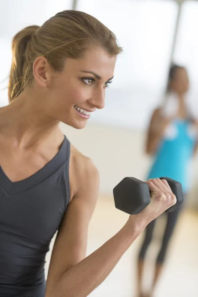 Happy Woman Lifting Dumbbell At Health Club — Stock Photo, Image