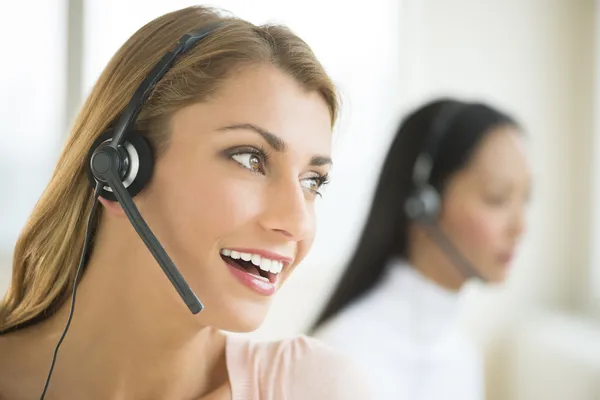 Happy Female Customer Service Representative Looking Away — Stock Photo, Image