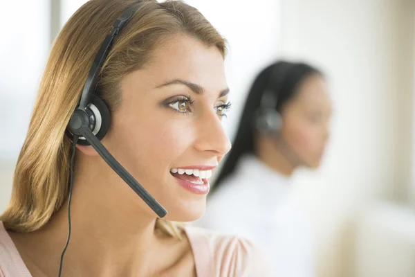 Female Customer Service Representative Looking Away — Stock Photo, Image