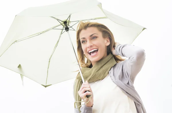 Cheerful Woman Looking Away While Holding Umbrella — Stock Photo, Image