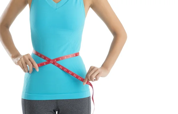 Midsection de mulher medindo sua cintura — Fotografia de Stock