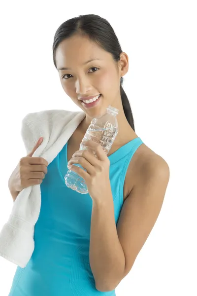 Mujer adulta feliz con toalla y botella de agua —  Fotos de Stock