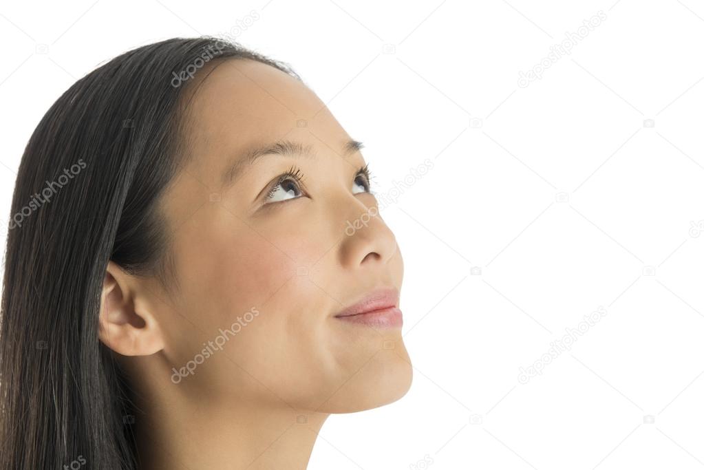 Close-Up Of Thoughtful Woman Smiling