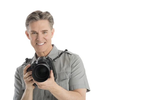 Mutlu erkek fotoğrafçı ile kamera ve şemsiye ışık — Stok fotoğraf