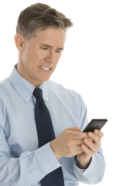 Angry Businessman Messaging Through Mobile Phone — Stock Photo, Image