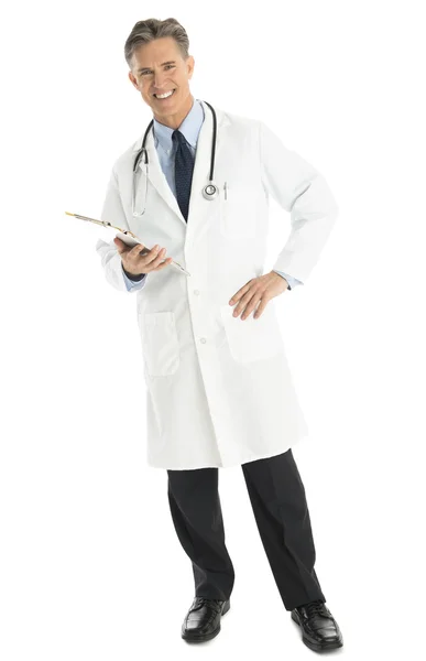 Confident Male Doctor With Hand On Hip Holding Clipboard — Stock Photo, Image