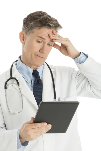 Confused Male Doctor Looking At Digital Tablet — Stock Photo, Image