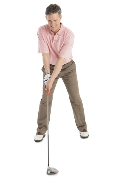 Älterer Mann spielt Golf auf weißem Hintergrund — Stockfoto