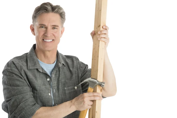 Happy Carpenter Holding Hammer And Plank — Stock Photo, Image