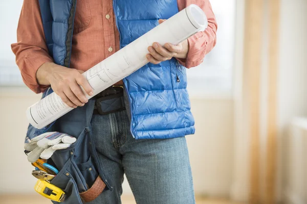 Midsection Of Construction Worker Holding Blueprint — Stock Photo, Image