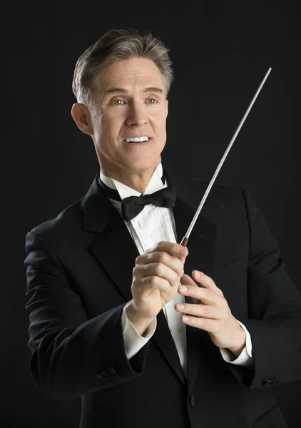 Music Conductor Smiling While Directing With His Baton — Stock Photo, Image