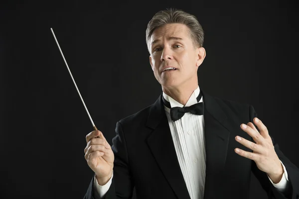 Music Conductor Looking Away While Directing With His Baton — Stock Photo, Image