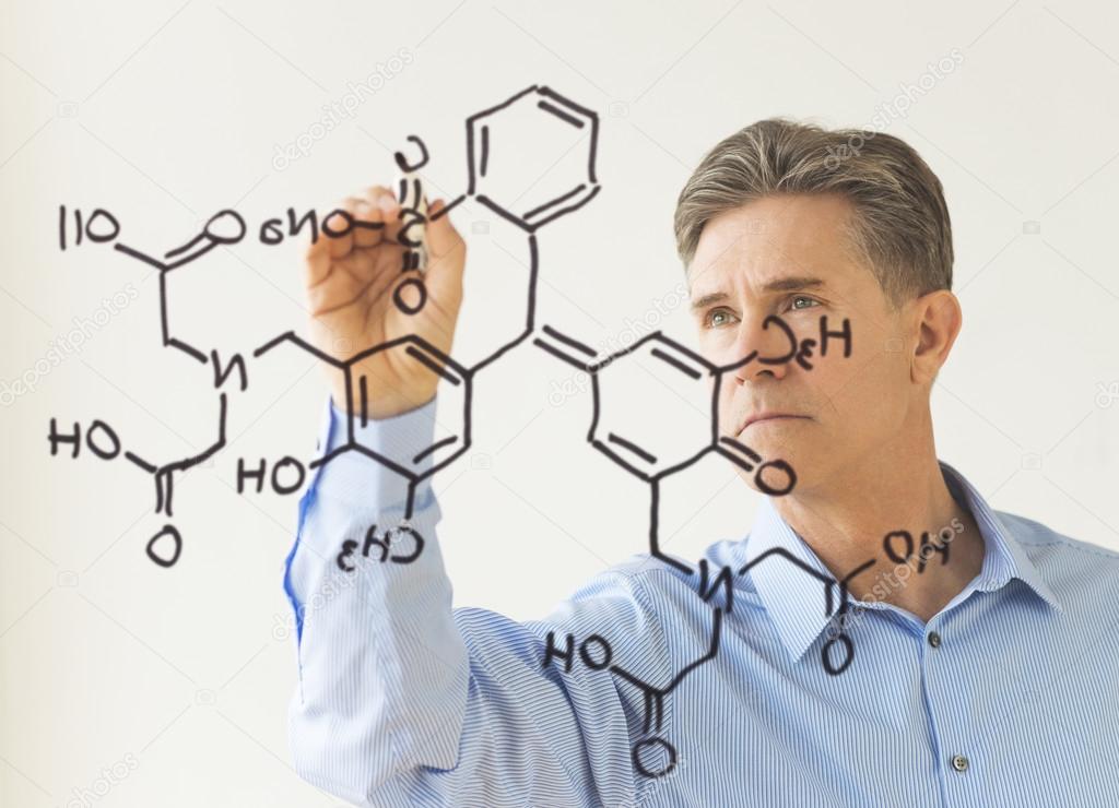 Scientist Drawing Molecular Structure On Transparent Board