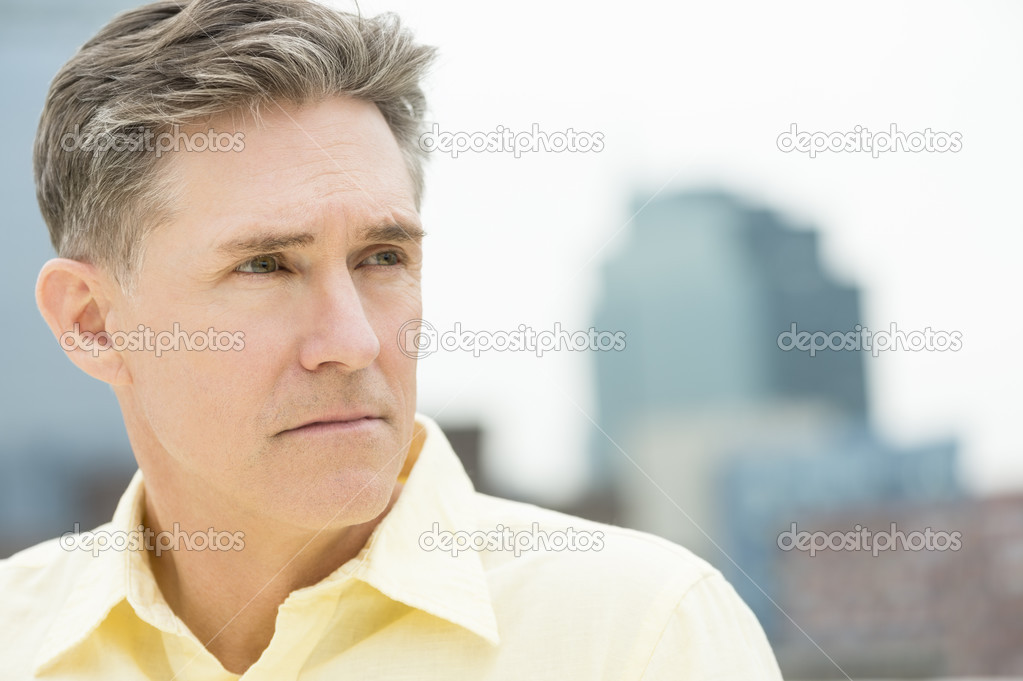 Closeup Of Thoughtful Mature Man Looking Away