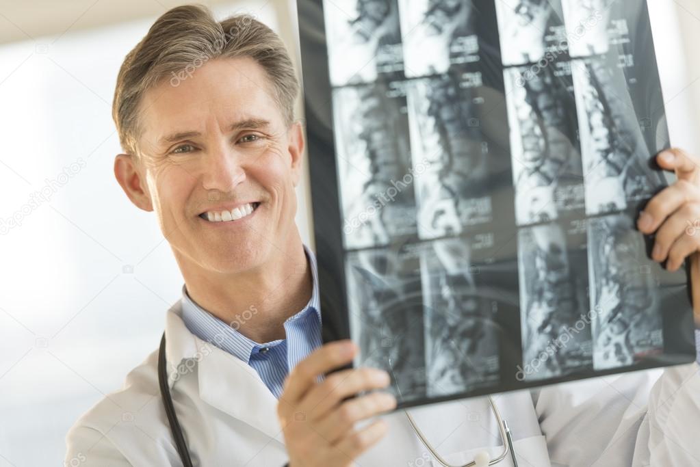 Confident Male Doctor With X-Ray Image