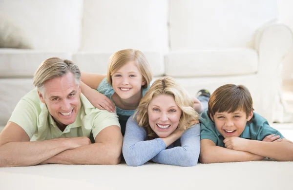 Family Lying On Floor At Home — Stock Photo, Image