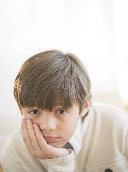 Bored Boy With Hand On Chin At Home — Stock Photo, Image