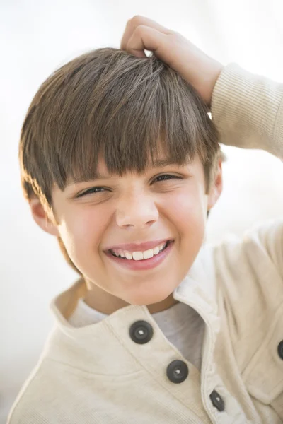 Happy Boy Scratching Head At Home — Stok Foto