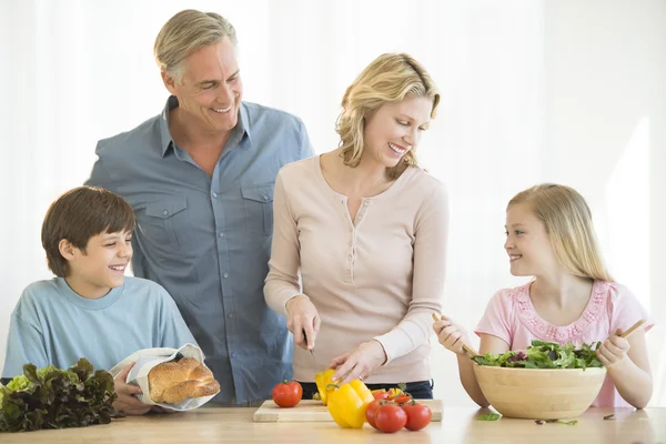 Parents And Children Cooking Food Together At Counter — Stock Photo, Image