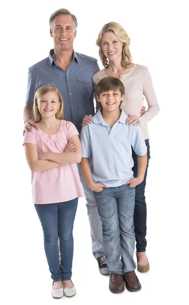 Familia feliz de cuatro sonriendo contra fondo blanco —  Fotos de Stock