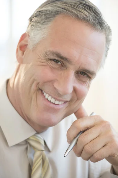 Close-Up Of Businessman Smiling In Office — Stock Photo, Image