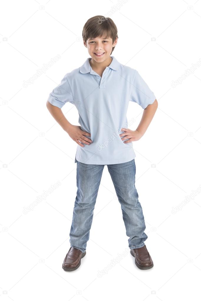 Boy Standing With Hands On Hip Against White Background