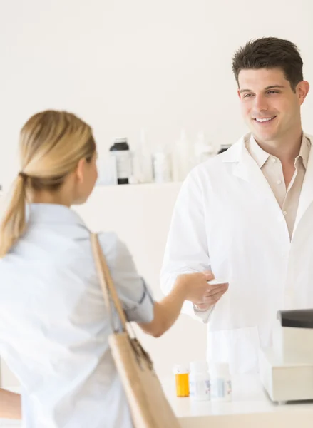 Customer Giving Prescription Paper To Pharmacist In Store — Stock Photo, Image