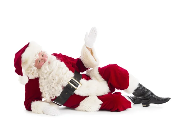 Porträt des Weihnachtsmannes, der am Boden liegend gestikuliert — Stockfoto