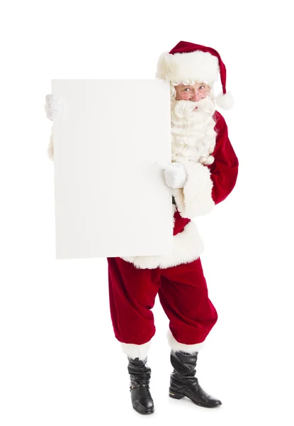 Santa claus wijzend op lege billboard — Stockfoto