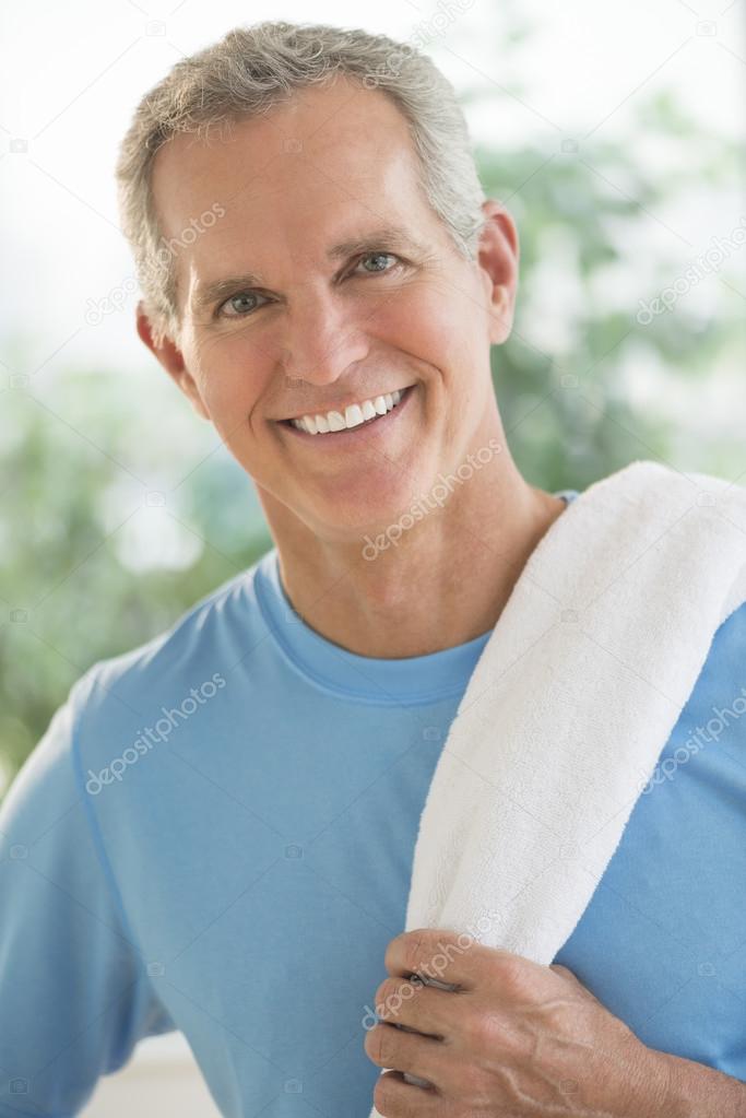 Portrait Of Happy Man With Towel On Shoulder