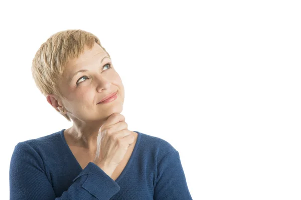 Doordachte vrouw met hand op kin opzoeken — Stockfoto