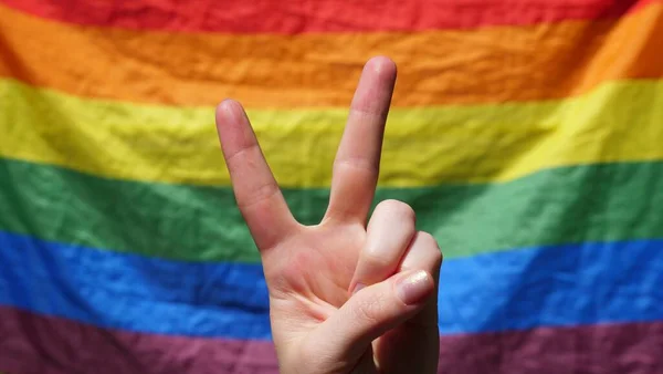 Symbol of peace on a rainbow background — Stock Photo, Image