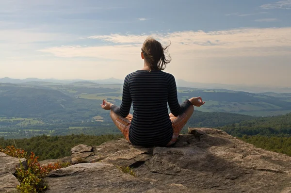 Meditating on a rock — Stock Photo, Image