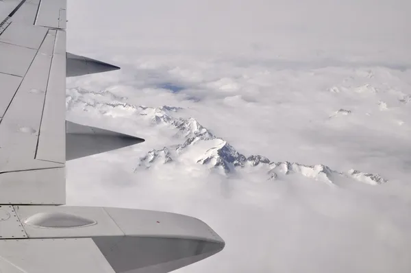 Wing aircraft over the mountains — Stock Photo, Image