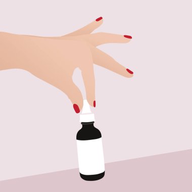 Serum şişesi pembe arka planda.