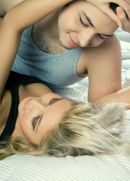 Lovely couple in bed — Stock Photo, Image