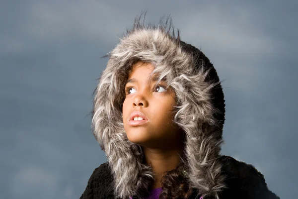 Cute girl wearing hoodie looking at the dark sky — Stock Photo, Image