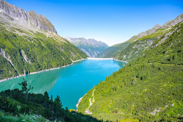 Beautiful alpine walley with azure blue water dam — Stock Photo, Image