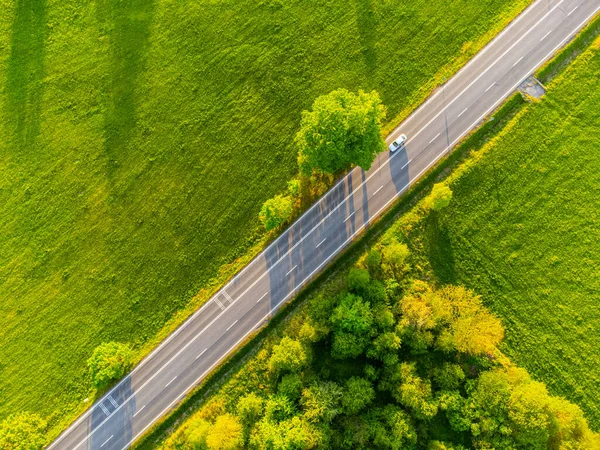 Straight asphalt road from above — стоковое фото