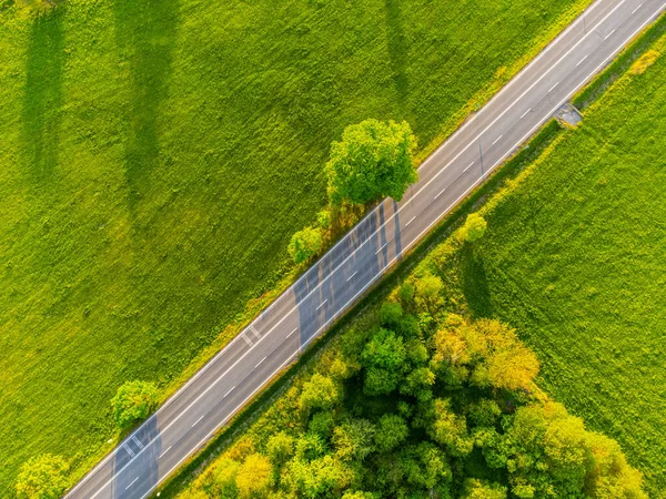 Straight asphalt road from above — стоковое фото